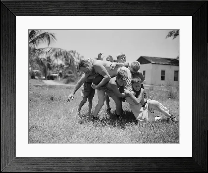 Framed Print : Jim Thorpe Playing Football with Children Framed Print : Jim Thorpe Playing Football with Children