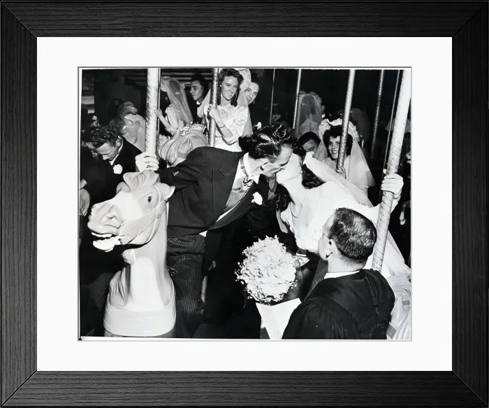 Framed Print : Couple Getting Married on Merry-Go-Round Framed Print : Couple Getting Married on Merry-Go-Round