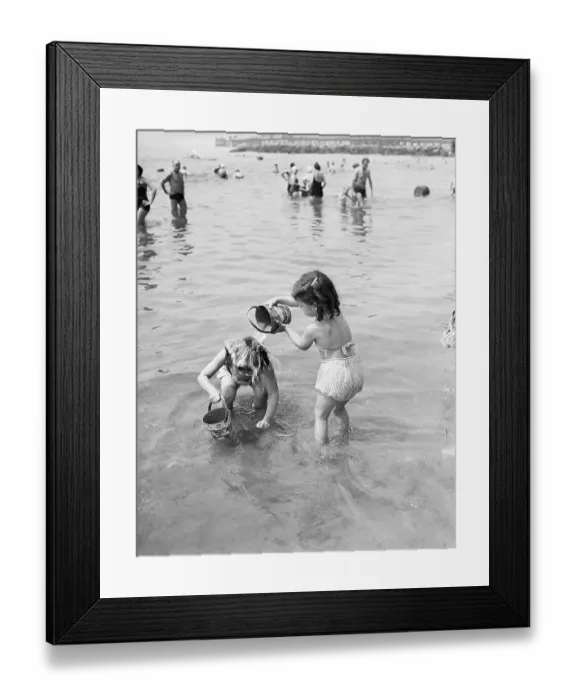 Framed Print : USA, New York City, Coney Island, Girls (6-7, 8-9) playing in water