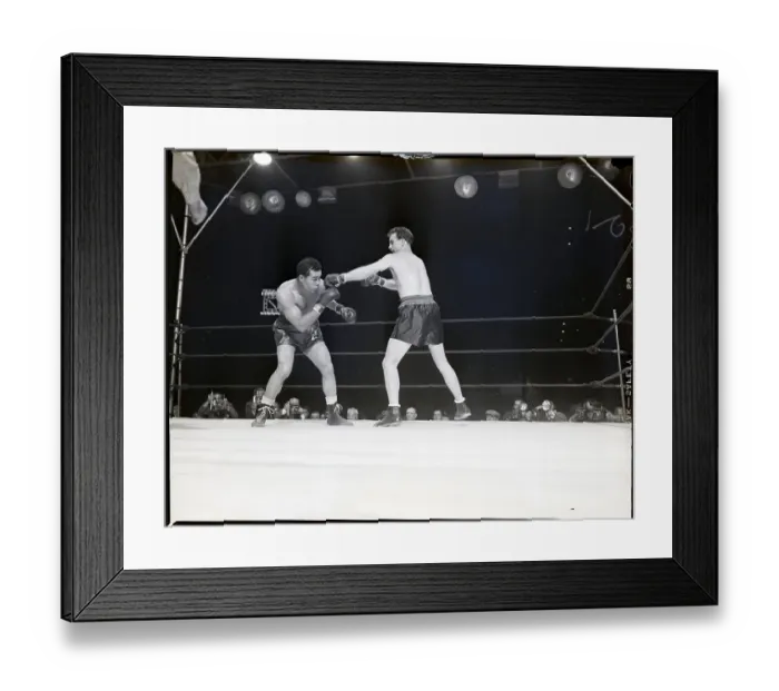 Framed Print : Joe Louis Ducks as Boxer Throws Punch Framed Print : Joe Louis Ducks as Boxer Throws Punch