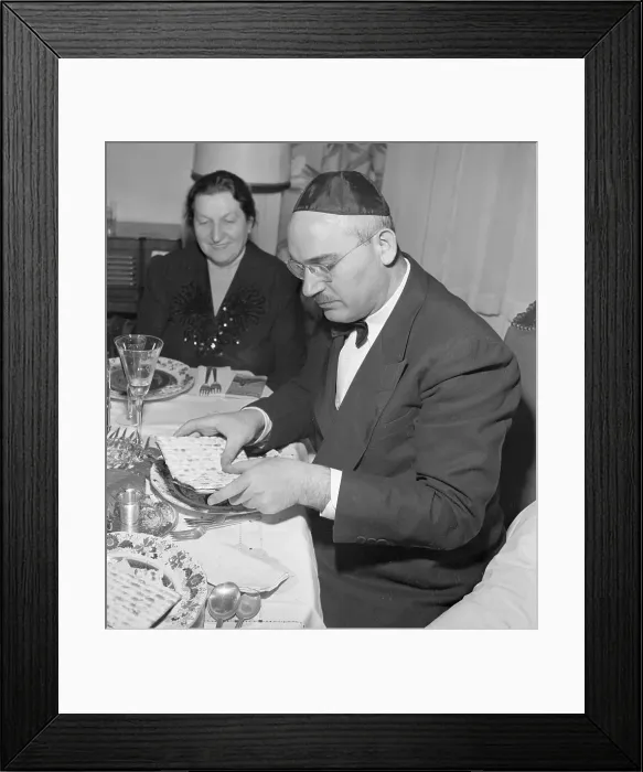 Framed Print : Man Breaks Matzoh for Passover Framed Print : Man Breaks Matzoh for Passover