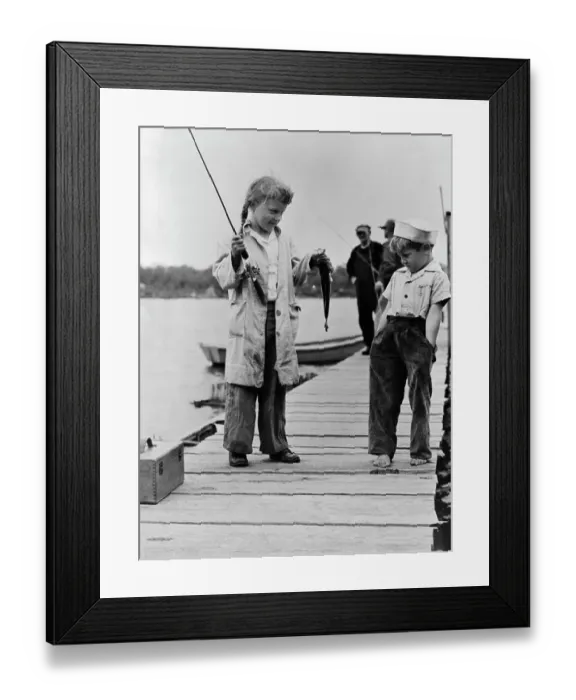 Framed Print : Youngster Displaying Catch on Dock Framed Print : Youngster Displaying Catch on Dock
