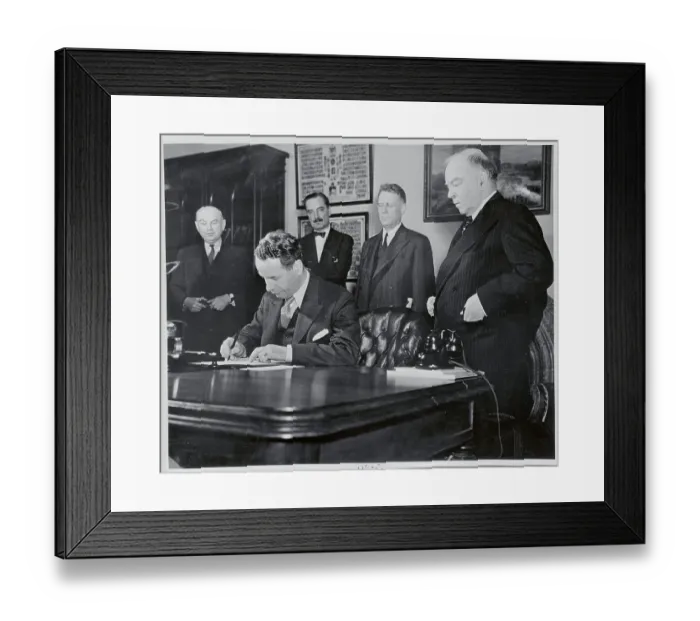 Framed Print : Malcolm MacDonald Signing an Agreement Framed Print : Malcolm MacDonald Signing an Agreement