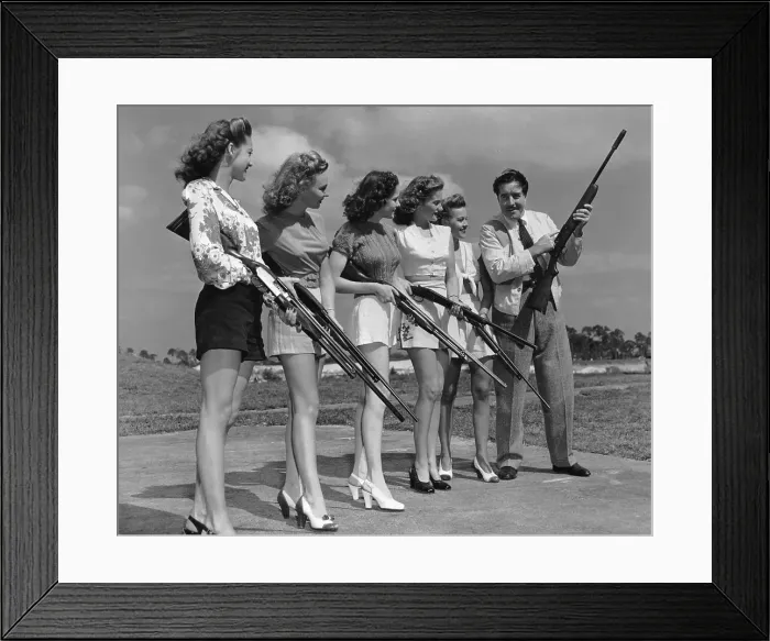 Framed Print : Man Showing Women how to Shoot Framed Print : Man Showing Women how to Shoot