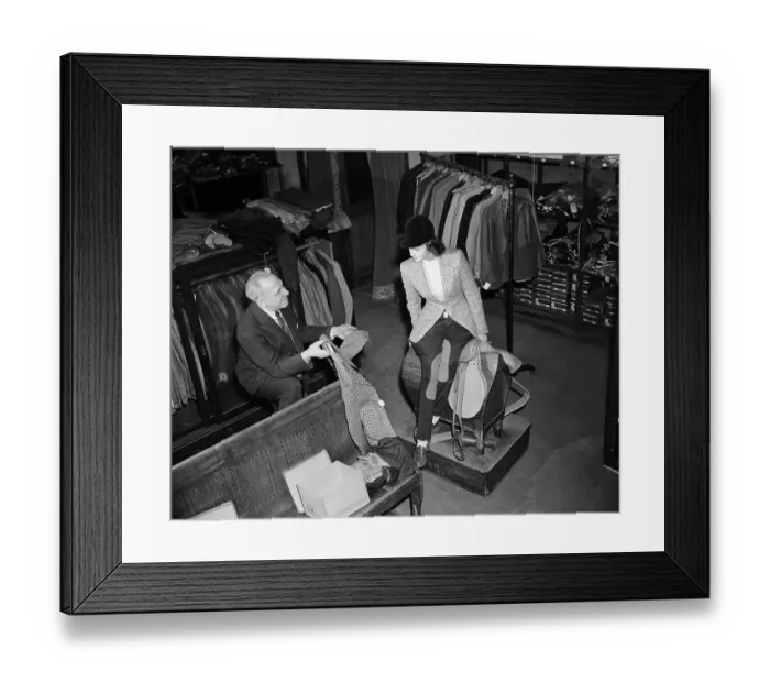 Framed Print : Jake Kauffmann Showing Jackets to Customer Framed Print : Jake Kauffmann Showing Jackets to Customer
