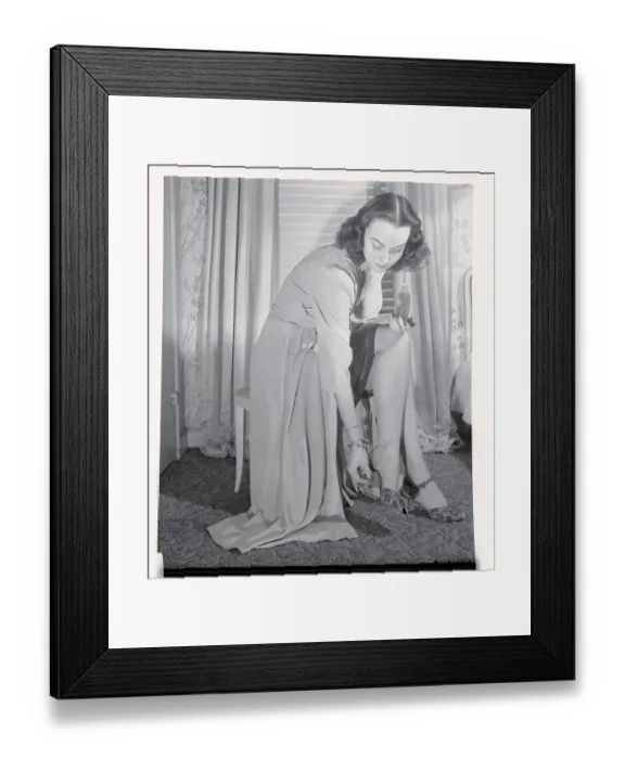 Framed Print : Woman Placing Perfumed Pad Inside Shoe Framed Print : Woman Placing Perfumed Pad Inside Shoe
