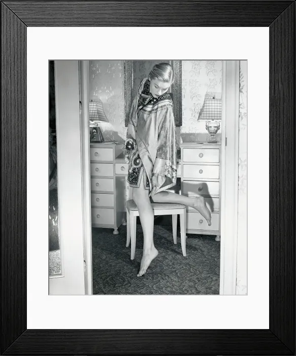 Framed Print : Woman Applying Perfume Behind Knee Framed Print : Woman Applying Perfume Behind Knee