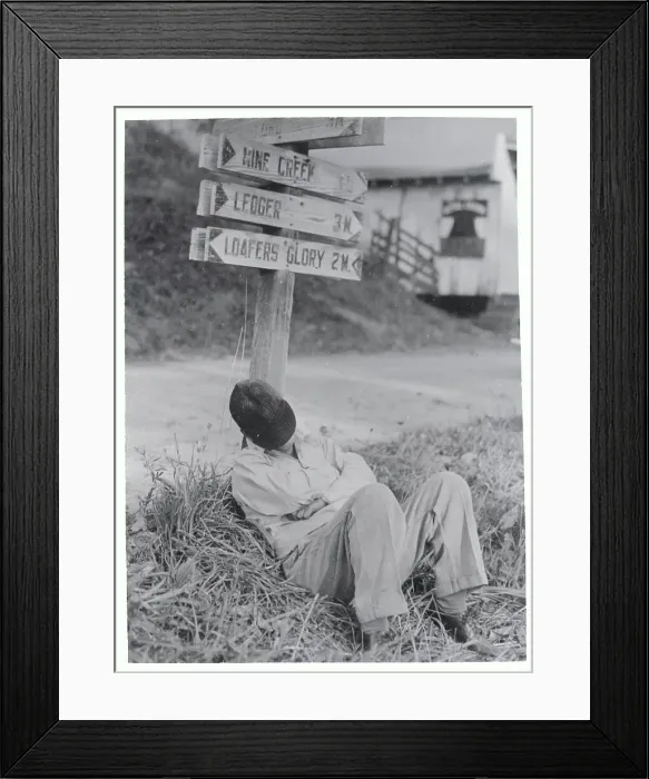 Framed Print : Man Sleeping Under Crossroads Signpost Framed Print : Man Sleeping Under Crossroads Signpost