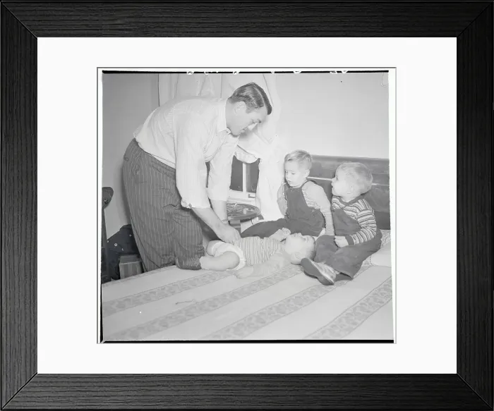 Framed Print : Father Changing Diapers Framed Print : Father Changing Diapers