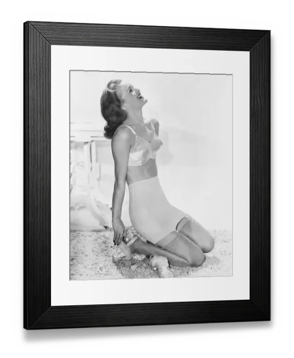 Framed Print : Woman Modeling Undergarments Made with Lastex Yarn Framed Print : Woman Modeling Undergarments Made with Lastex Yarn