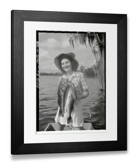 Framed Print : Kathleen Turner Displaying Fish She Caught Framed Print : Kathleen Turner Displaying Fish She Caught