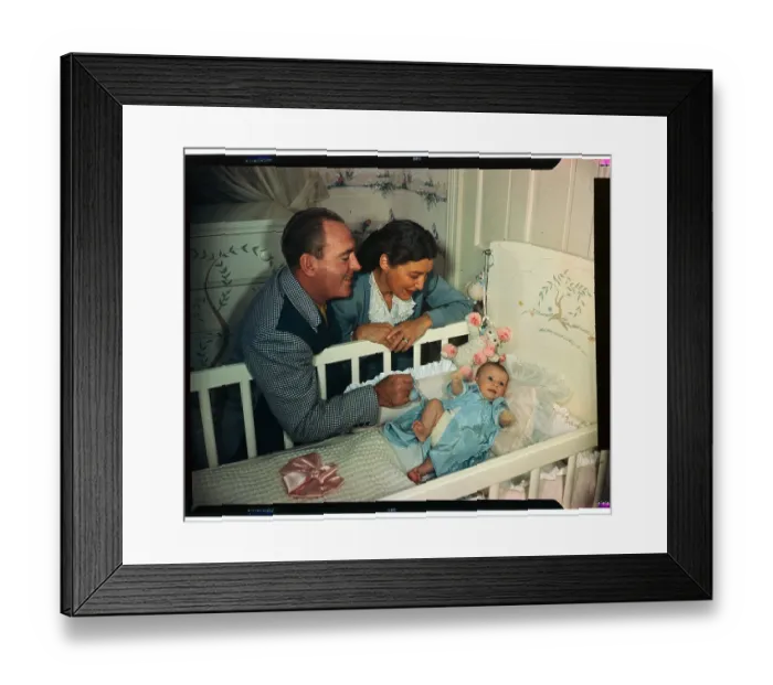 Framed Print : Mr. and Mrs. Pat O'Brien Talking to Baby in Crib Framed Print : Mr. and Mrs. Pat O'Brien Talking to Baby in Crib