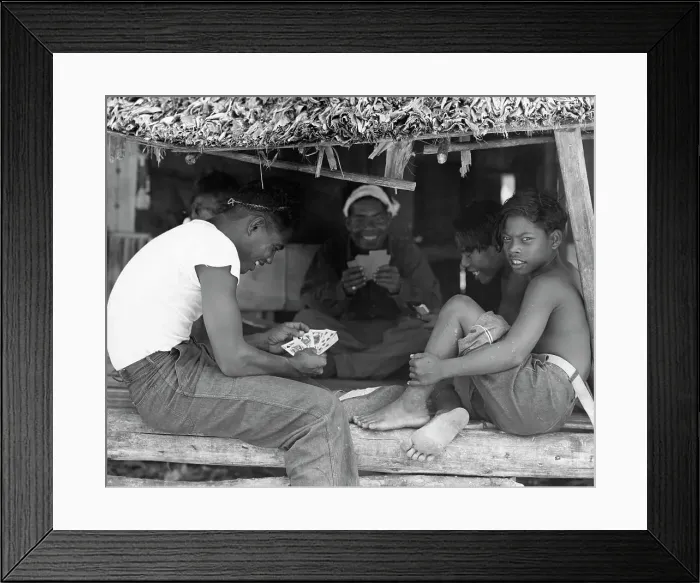 Framed Print : Island Natives Playing Cards in Makeshift Hut