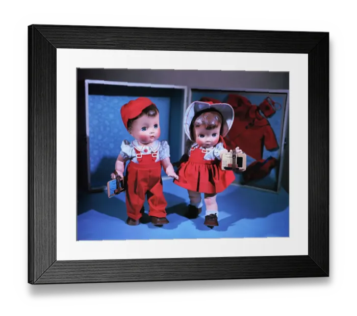 Framed Print : Boy and Girl Dolls Wearing Matching School Outfits
