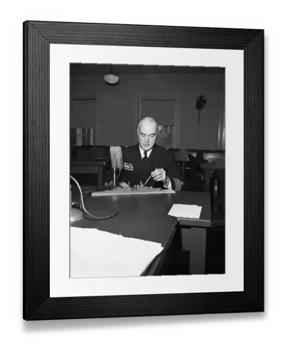 Framed Print : Officer Pointing at Ship Model