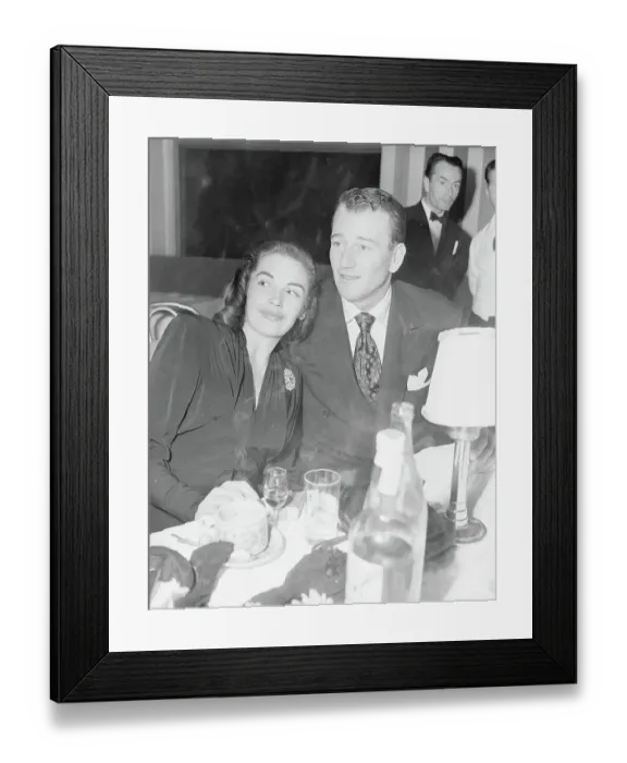 Framed Print : John Wayne and Esperanza Baur at Table Framed Print : John Wayne and Esperanza Baur at Table