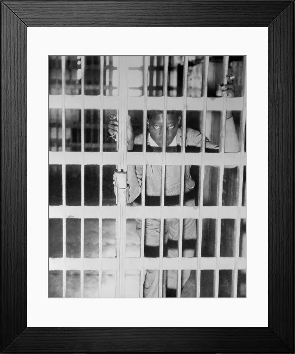 Framed Print : Heywood Patterson Gazing from Behind Jail Bars Framed Print : Heywood Patterson Gazing from Behind Jail Bars