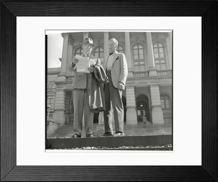 Framed Print : Robert E. Burns Holding Papers Framed Print : Robert E. Burns Holding Papers
