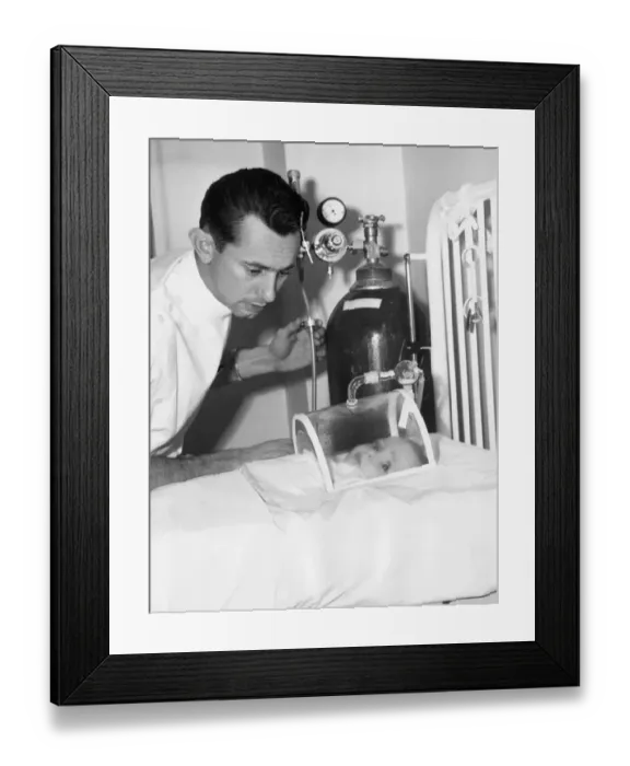 Framed Print : Doctor Checking Infant in Mask Framed Print : Doctor Checking Infant in Mask
