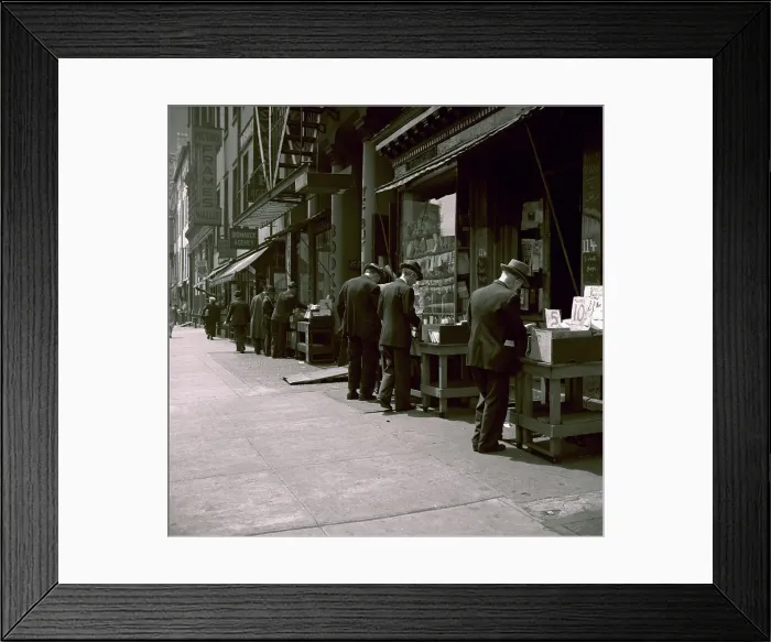 Framed Print : People Browsing Through Used Books Framed Print : People Browsing Through Used Books