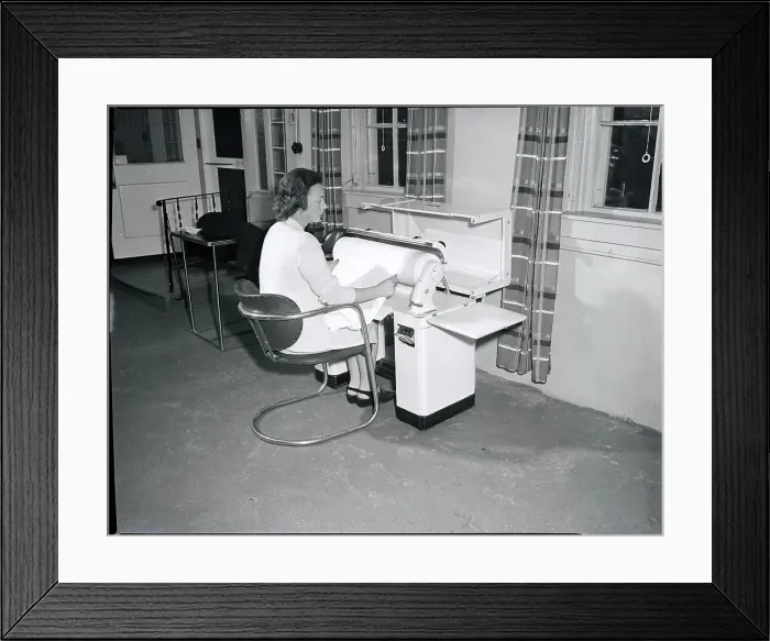 Framed Print : Woman Ironing Her Clothes In Laundromat Framed Print : Woman Ironing Her Clothes In Laundromat