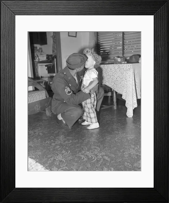 Framed Print : Soldier Hugs Daughter in Living Room Framed Print : Soldier Hugs Daughter in Living Room