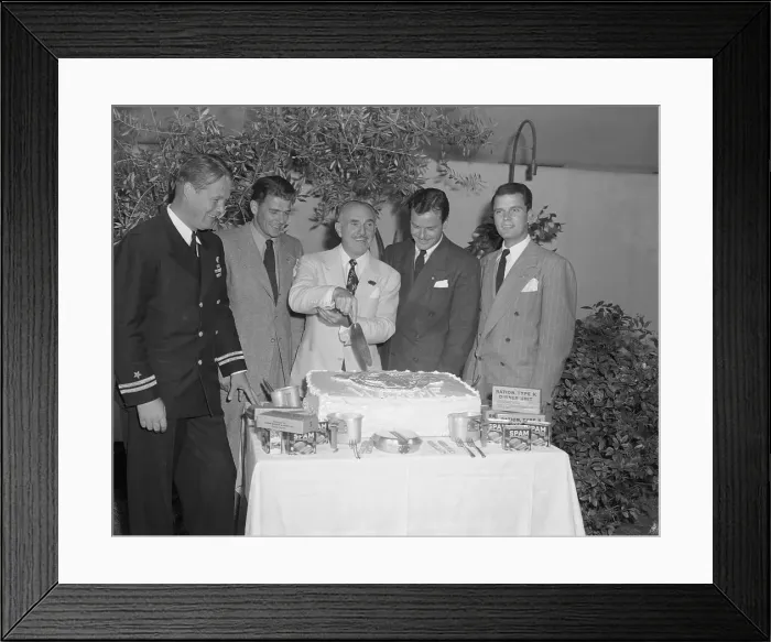 Framed Print : Jack Warner Cutting a Cake Framed Print : Jack Warner Cutting a Cake