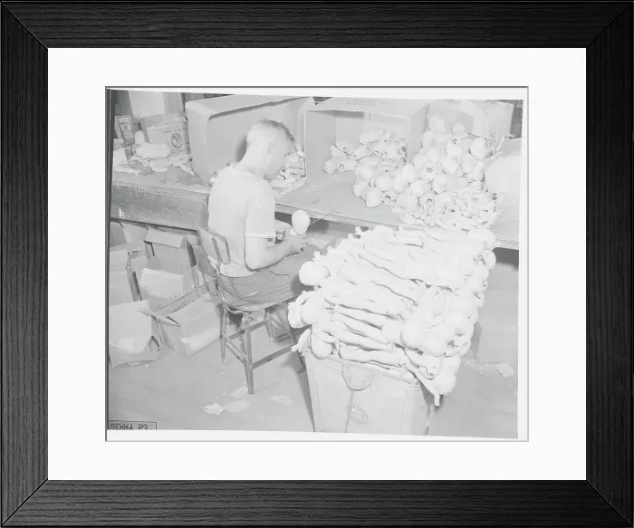 Framed Print : Man Putting Toys Together