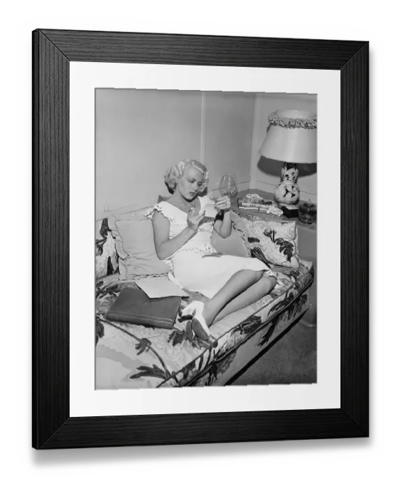 Framed Print : Lana Turner Inspects Photos Of Herself Framed Print : Lana Turner Inspects Photos Of Herself