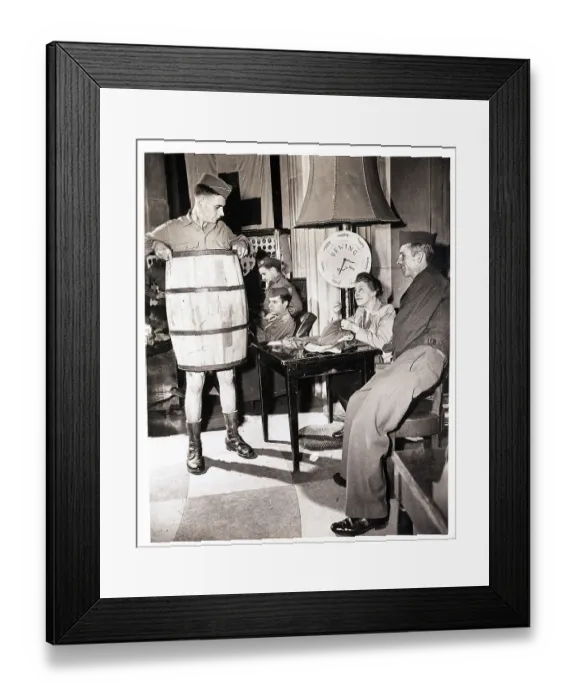 Framed Print : Soldier Wears Barrel while Woman Sews Pants