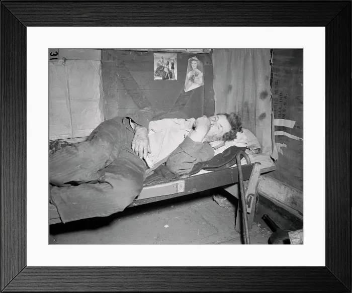 Framed Print : Hobo Lying on His Cot Framed Print : Hobo Lying on His Cot