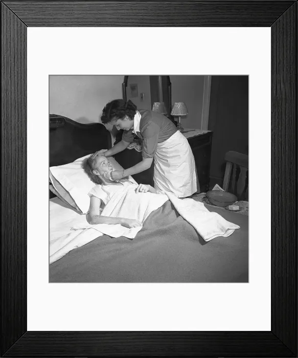 Framed Print : Visiting Nurse Tending to Bedridden Patient
