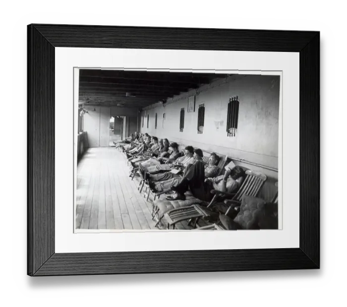Framed Print : Row of Passengers on Ship Deck Chairs