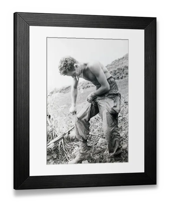 Framed Print : Rifleman Scraping Mud From His Trousers Framed Print : Rifleman Scraping Mud From His Trousers