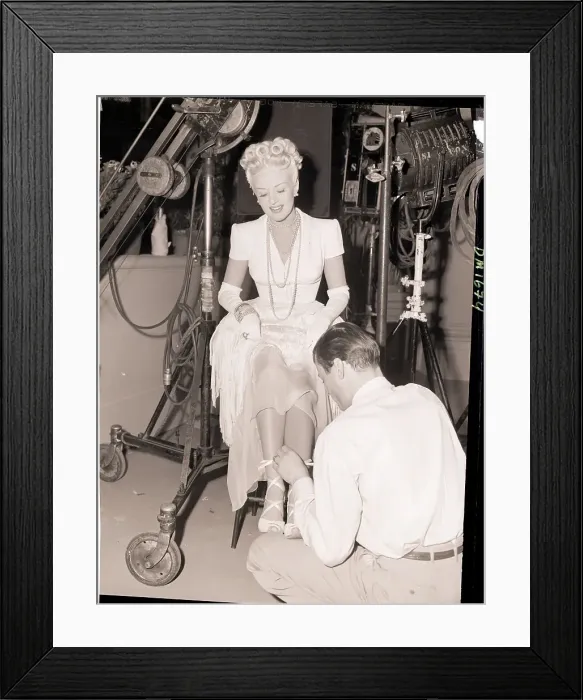 Framed Print : Betty Grable Having Her Shoe Laces Tied Framed Print : Betty Grable Having Her Shoe Laces Tied