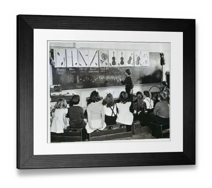 Framed Print : Teacher Points To A French Horn In Class Framed Print : Teacher Points To A French Horn In Class