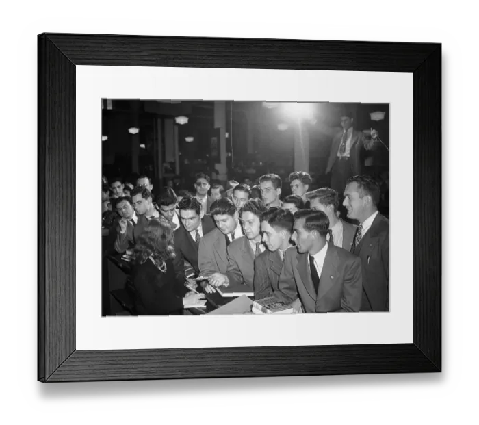 Framed Print : Military Veterans Receiving Books Framed Print : Military Veterans Receiving Books
