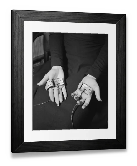 Framed Print : Pair of Hands Wearing Lie Detector Device