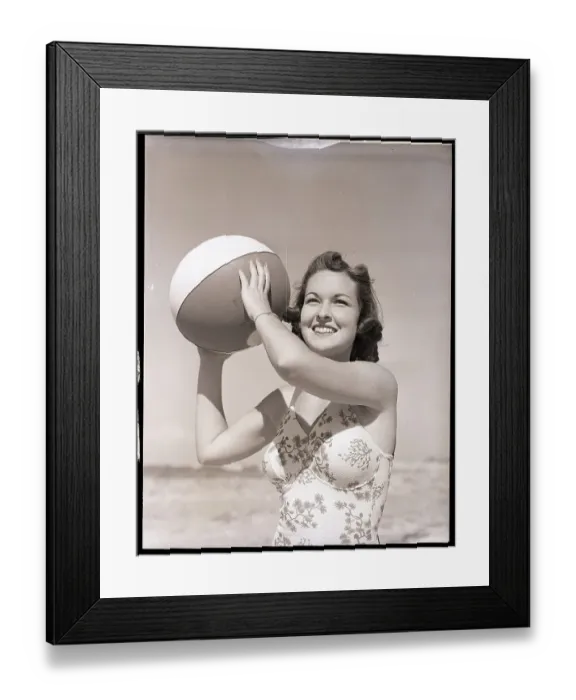 Framed Print : Woman Holding Beach Ball Framed Print : Woman Holding Beach Ball