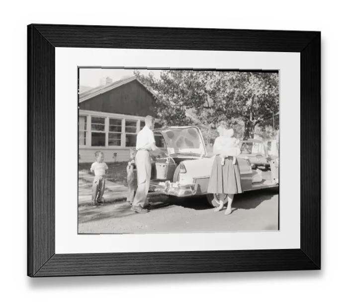 Framed Print : Family Placing Picnic Basket in Car Framed Print : Family Placing Picnic Basket in Car