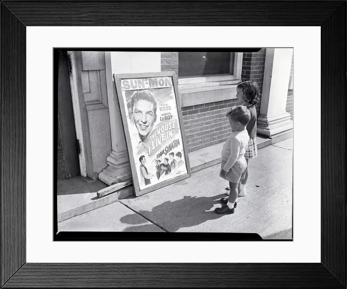 Framed Print : Two Children Stand in Front of Theater Framed Print : Two Children Stand in Front of Theater