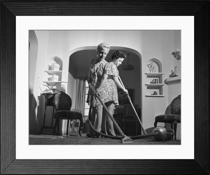 Framed Print : Siamese Twins Vacuuming at Home Framed Print : Siamese Twins Vacuuming at Home