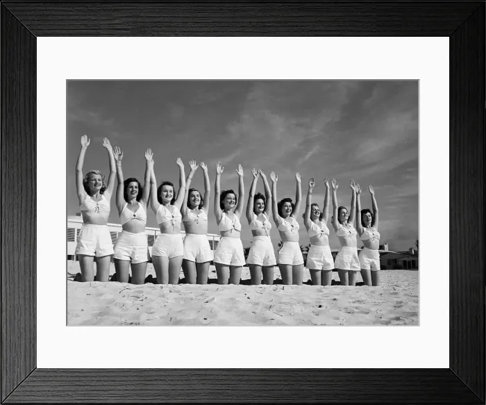 Framed Print : Line Of Woman On Beach With Arms Raised Framed Print : Line Of Woman On Beach With Arms Raised