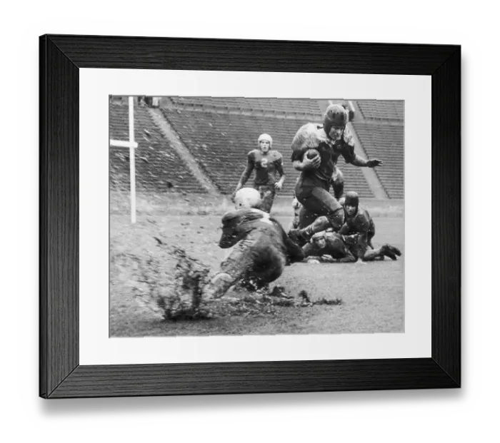 Framed Print : Football Tackle In Muddy, Rainy Weather Framed Print : Football Tackle In Muddy, Rainy Weather