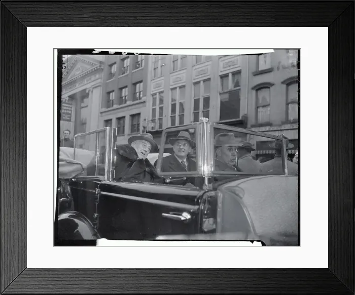 Framed Print : Politicians Riding Past Building in Car Framed Print : Politicians Riding Past Building in Car