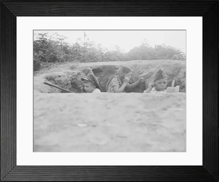 Framed Print : USA, New York State, Long Island, Nassau County, Hempstead, Boys (6-7, 8-9 )inside makeshift foxhole playing solider Framed Print : USA, New York State, Long Island, Nassau County, Hempstead, Boys (6-7, 8-9 )inside makeshift foxhole playing solider