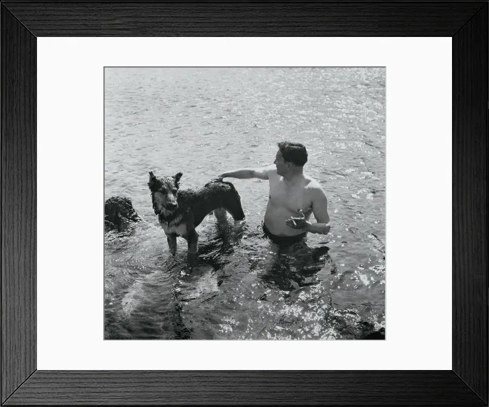 Framed Print : Tito Swimming With His Dog Framed Print : Tito Swimming With His Dog