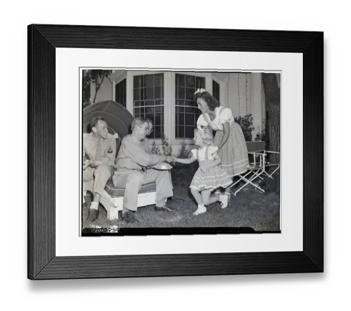 Framed Print : Joan Crawford and Daughter Christina with Servicemen Framed Print : Joan Crawford and Daughter Christina with Servicemen