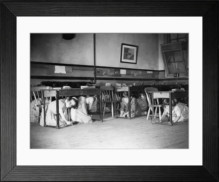 Framed Print : Children Kneel Under Desks During Air Raid Drill Framed Print : Children Kneel Under Desks During Air Raid Drill