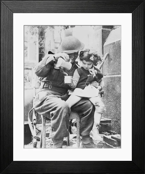 Framed Print : Soldier Sharing Soup with Young Girl